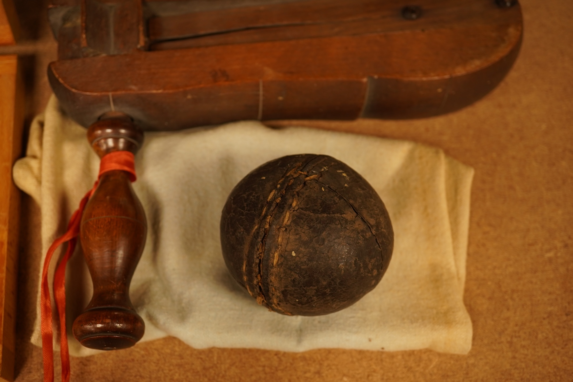 Two boxed chess sets, a cricket ball and a bird scaring rattle, largest chess set 32cm wide x 9cm high x 20cm deep.